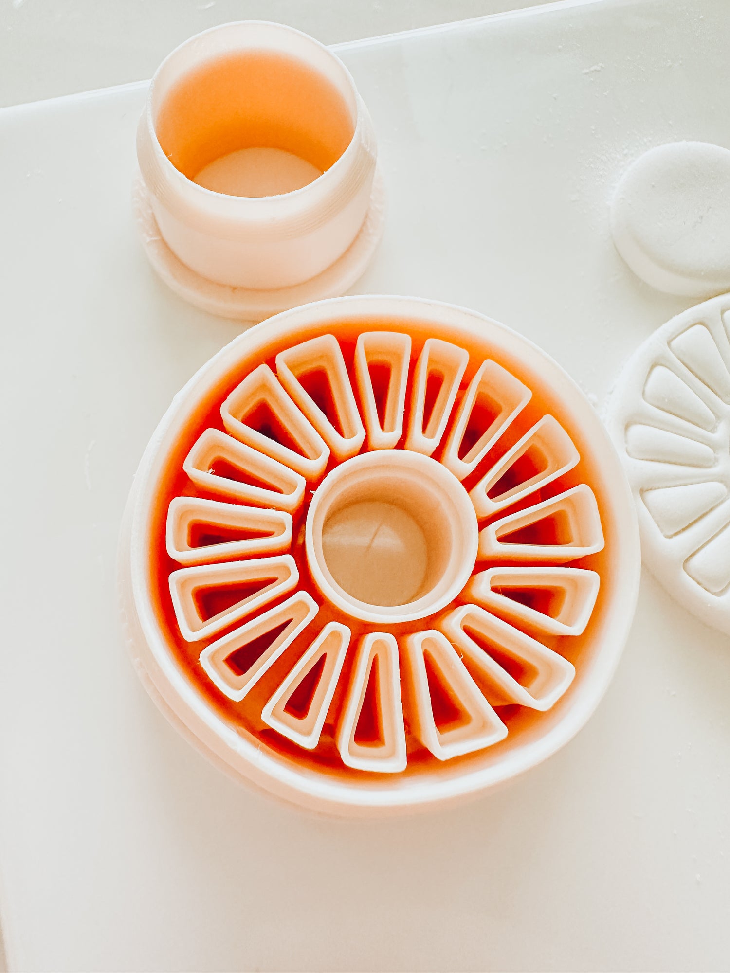 A close up image of a 3D printer polymer clay cutter featuring embossed matisse-inspired design.